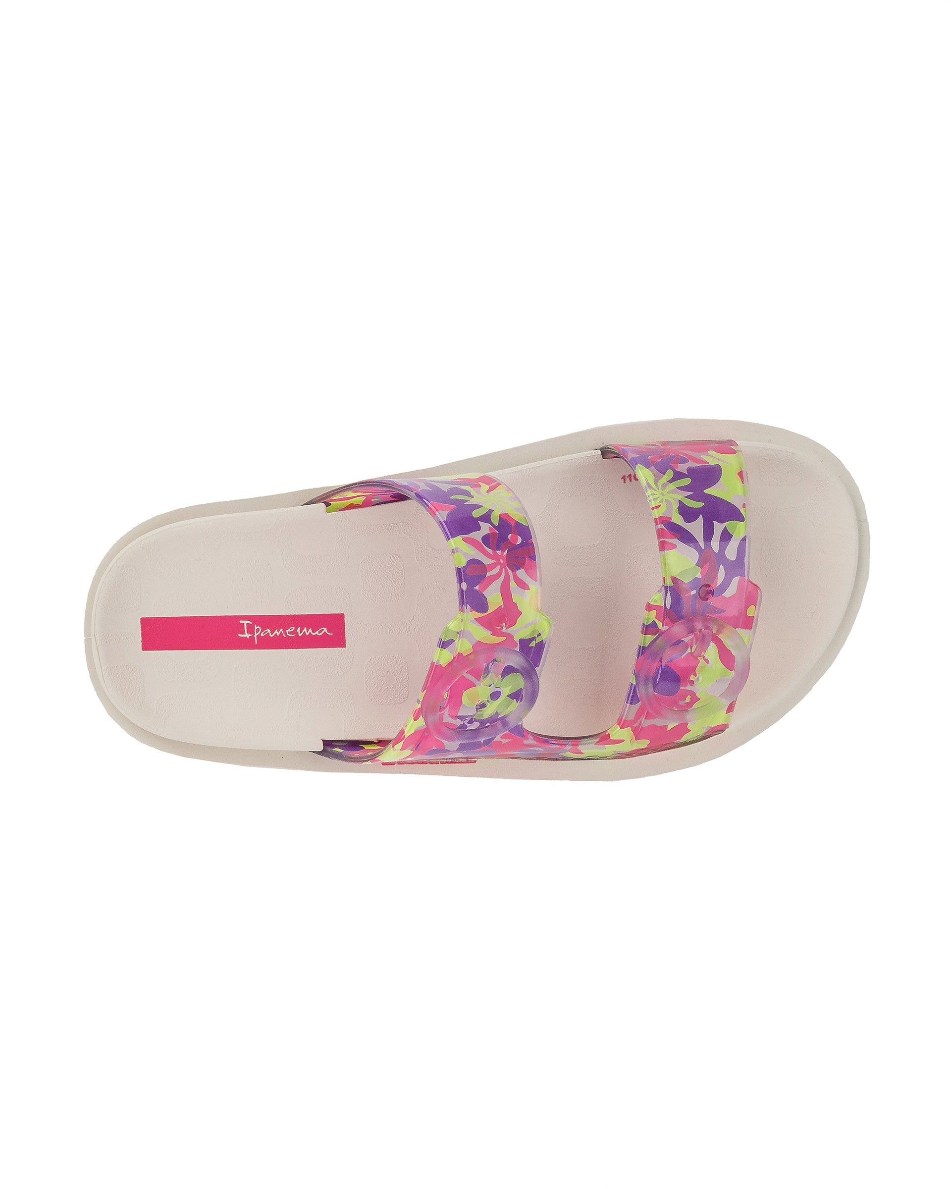 Top view of a beige Ipanema Follow kids slide with floral print on the upper.