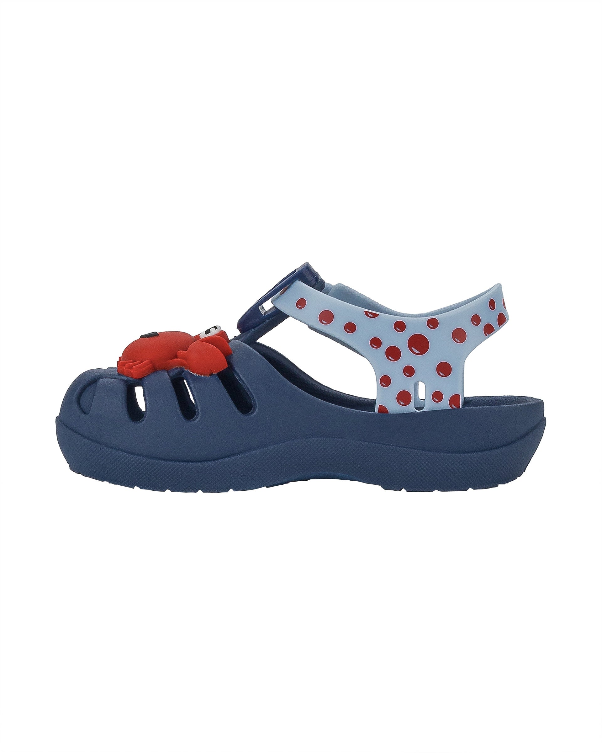 Inner side view of a blue/light blue Ipanema Summer baby fisherman sandal with red crab on the upper.