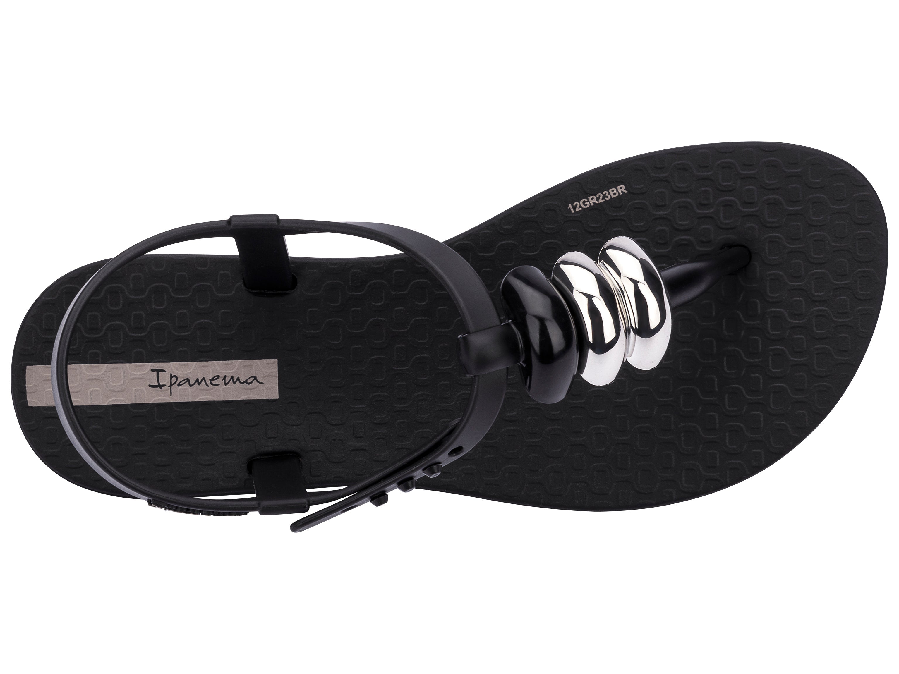 Top view of a black Ipanema Class kids' t-strap sandal with 3 baubles on the strap.