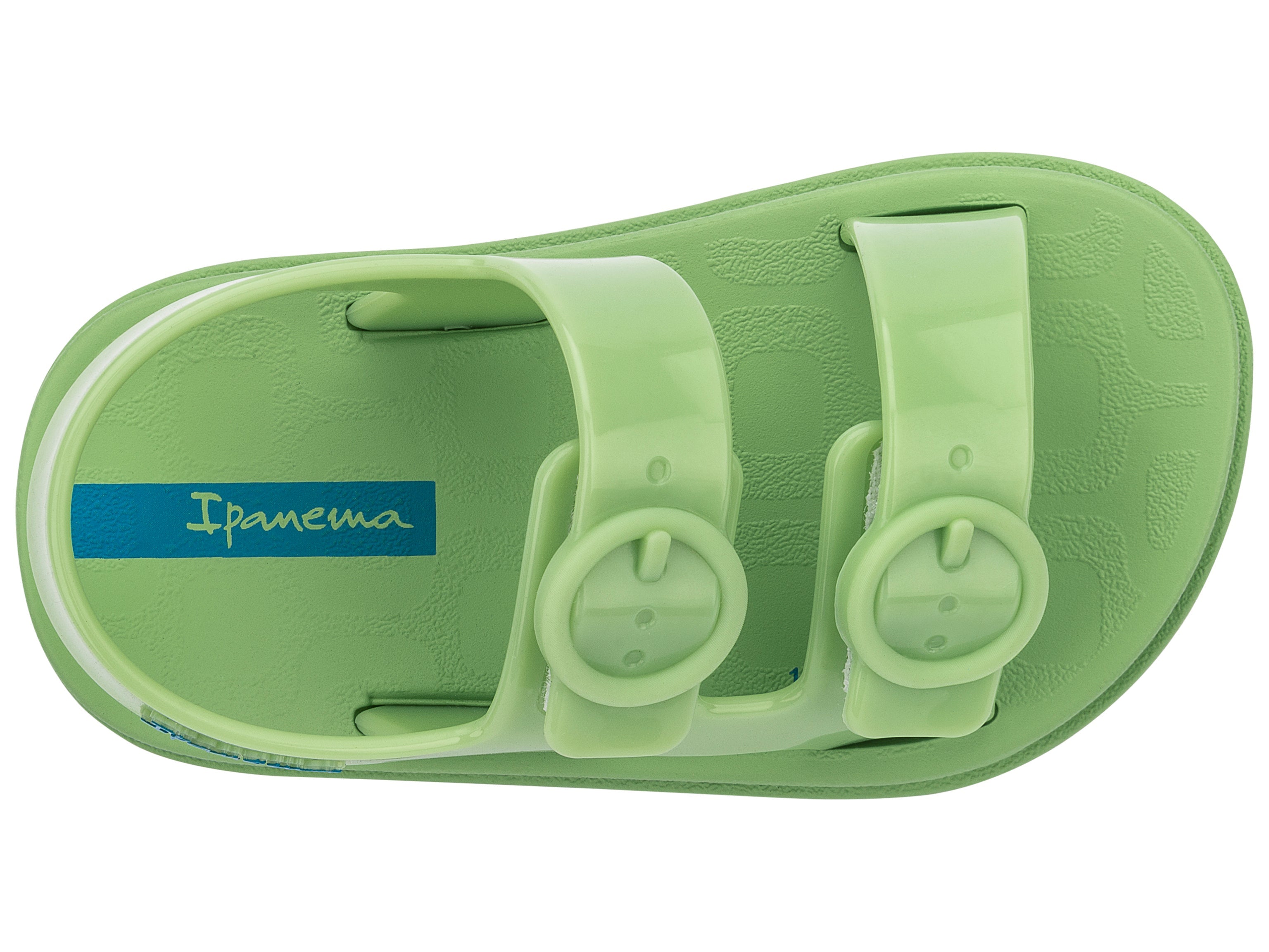 Top view of a green Ipanema Follow baby sandal with two decorative buckles on the upper.
